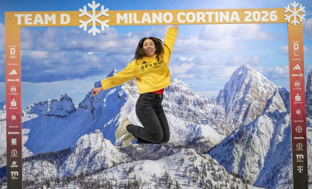 19 January 2026, Bavaria, Munich: German alpine ski racer Kira Weidle-Winkelmann poses in front of a photo wallpaper with a mountain motif during the clothing fitting for the Winter Olympics in Milan. Photo: Peter Kneffel/dpa