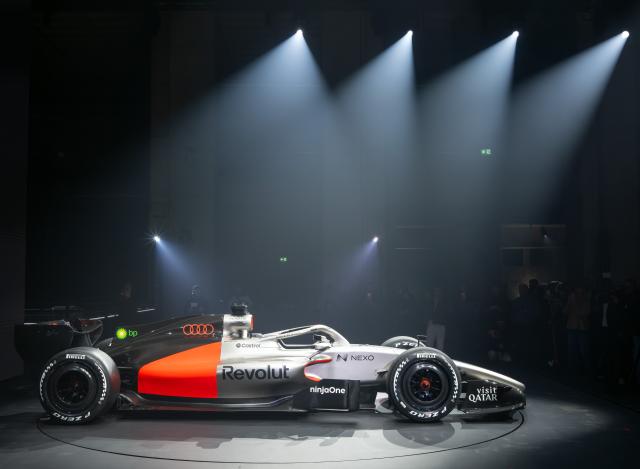 20 January 2026, Berlin: Audi Revolut's R26 Formula 1 race car is illuminated by spotlights on a rotating stage during the vehicle's presentation at the Kraftwerk Mitte power station. Photo: Soeren Stache/dpa