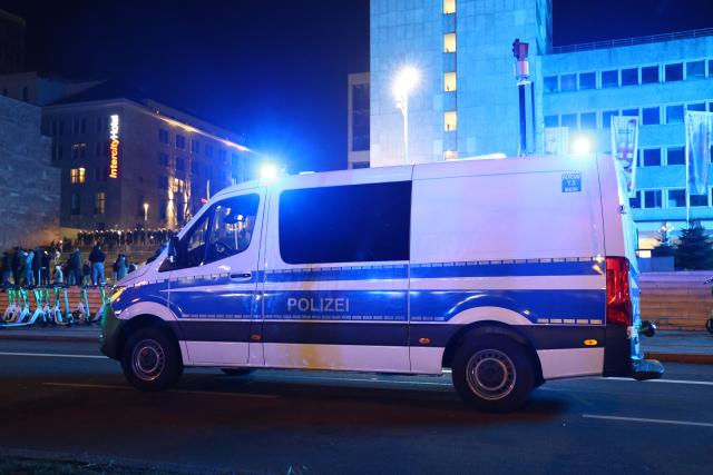 20 January 2026, North Rhine-Westphalia, Dortmund: A police car drives along a road at the edge of a pro-Kurdish demonstration under the slogan "Against the killing of innocent people, civilians, and children." Photo: Alex Talash/dpa
