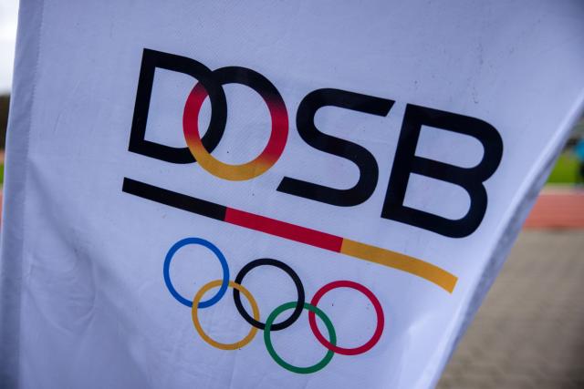 FILED - 07 December 2024, Saarbruecken: The flag of the German Olympic Sports Federation (DOSB) is pictured after a general meeting. DOSB believes that Germany has a strong case to be awarded an Olympics ahead of the bidding selection process. Photo: Laszlo Pinter/dpa