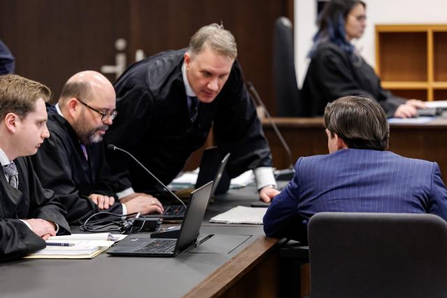 21 January 2026, Bavaria, Nuremberg: A defendant sits in the courtroom of the Criminal Justice Center at the Nuremberg-Fuerth Regional Court at the start of the trial. The 27-year-old is accused of deliberately killing a 47-year-old man with several shots to the upper body at a wedding reception in Fuerth, on March 23, 2025. Photo: Daniel Karmann/dpa