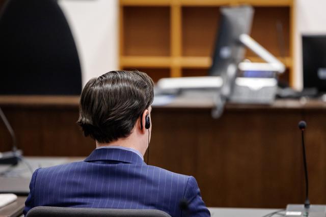 21 January 2026, Bavaria, Nuremberg: A defendant sits in the courtroom of the Criminal Justice Center at the Nuremberg-Fuerth Regional Court at the start of the trial. The 27-year-old is accused of deliberately killing a 47-year-old man with several shots to the upper body at a wedding reception in Fuerth, on March 23, 2025. Photo: Daniel Karmann/dpa
