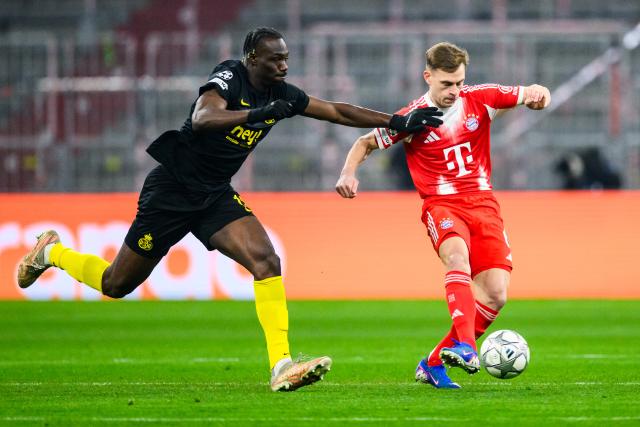 21 January 2026, Bavaria, Munich: Union St. Gilloise'S Promise David (L) and Bayern Munich's Joshua Kimmich battle for the ball during the UEFA Champions League soccer match between Bayern Munich and Union St. Gilloise at the Allianz Arena. Photo: Tom Weller/dpa