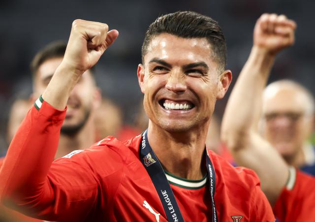 FILED - 09 June 2025, Bavaria, Munich: Portugal's Cristiano Ronaldo celebrates at the award ceremony after the UEFA Nations League A soccer match between Portugal and Spain at Munich Football Arena. Photo: Christian Charisius/dpa