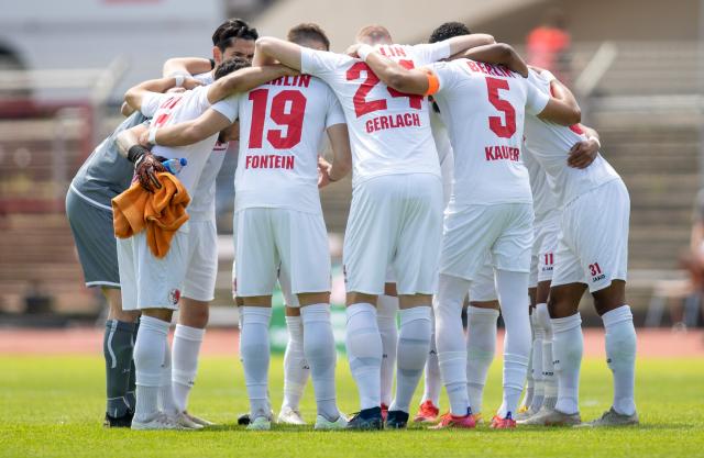 FILED - 29 May 2021, Berlin: The Berliner AK 07 team stands together in a circle before the start of the soccer match against BFC Dynamo at Mommsenstadion. The under-19 team of German fifth division club Berliner AK will play friendly matches against junior sides of Russian clubs Spartak Moscow and Krasnodar during an upcoming training camp in Turkey. Photo: Andreas Gora/dpa
