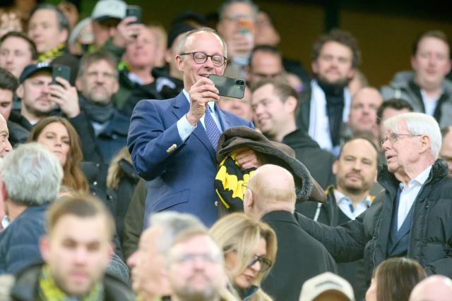 FILED - 17 January 2026, North Rhine-Westphalia, Dortmund: German Chancellor Friedrich Merz in the stands during the German Bundesliga soccer match between Borussia Dortmund and FC St. Pauli at the Signal Iduna Park. Photo: Bernd Thissen/dpa - IMPORTANT NOTE: In accordance with the regulations of the DFL German Football League and the DFB German Football Association, it is prohibited to utilize or have utilized photographs taken in the stadium and/or of the match in the form of sequential images and/or video-like photo series.