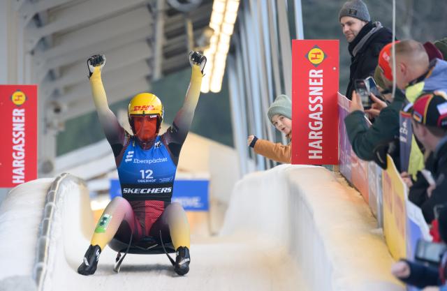 23 January 2026, Thuringia, Oberhof: Germany's Merle Fraebel in celebrates winning the women's singles 1st round competition at the Luge World Cup. Photo: Robert Michael/dpa