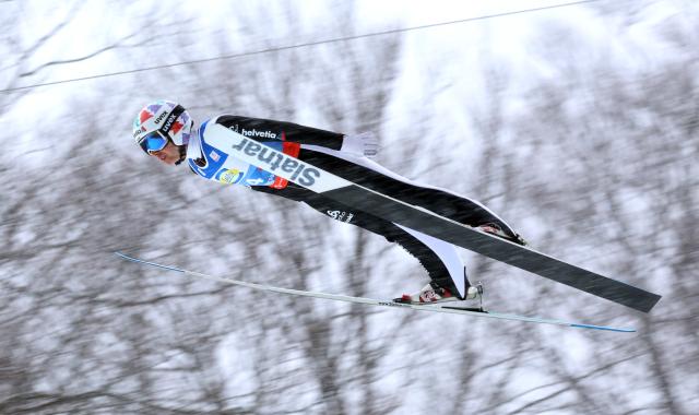 25 January 2026, Bavaria, Oberstdorf: Switzerland's Simon Ammann competes in the men's team flying trial round at the Nordic Skiing/Ski Jumping World Championships. Photo: Karl-Josef Hildenbrand/dpa