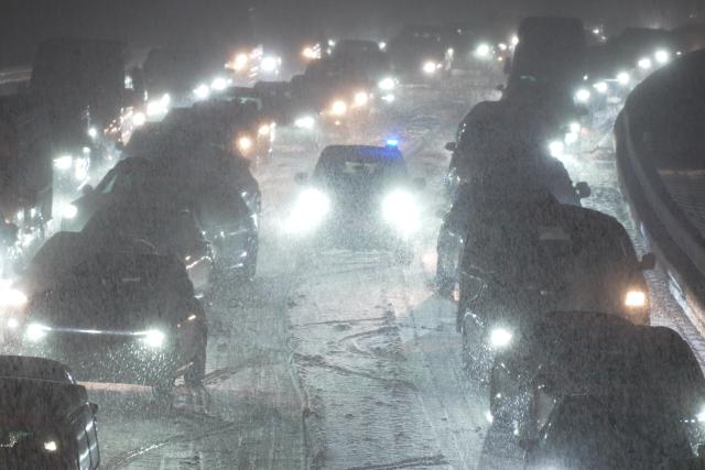 25 January 2026, Baden-Wuerttemberg, Aichelberg: Cars and trucks are stuck on Highway 8 between Kirchheim Teck-Ost and Muehlhausen as heavy snowfall causes a long traffic jam. Photo: Enrique Kaczor/onw-images/dpa