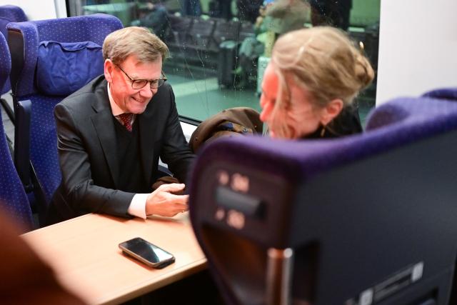 26 January 2026, Berlin: Germany's Foreign Minister Johann Wadephul sits in an ICE train at the main station to travel to Leipzig Airport for a trip to Latvia and Sweden. Due to freezing rain, the flight was moved from Berlin to Leipzig. Photo: Sebastian Christoph Gollnow/dpa