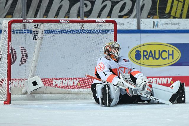 FILED - 24 April 2022, Bavaria, Munich: Wolfsburg goalkeeper Dustin Strahlmeier sits on the ice after scoring a goal during the DEL semi final Ice hockey match between EHC Red Bull Munich and Grizzlies Wolfsburg at Olympia-Eissportzentrum. Strahlmeier has made German Ice Hockey League (DEL) history by becoming the first goalkeeper to score a proper goal. Photo: Lennart Preiss/dpa