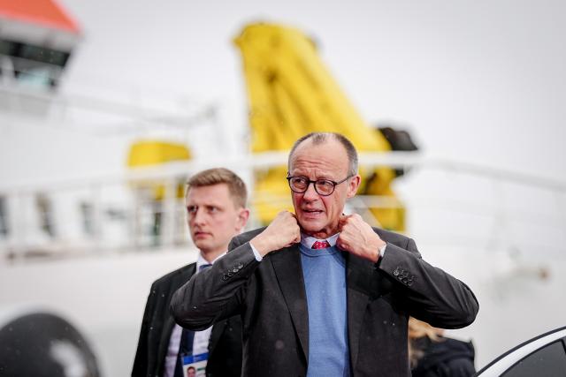 26 January 2026, Hamburg: German Chancellor Friedrich Merz arrives to the summit of the North Sea states in Hamburg. The meeting of heads of government and energy ministers will focus on the expansion of offshore wind farms and other projects in the energy sector. Photo: Kay Nietfeld/dpa