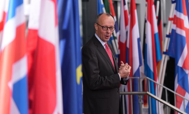 26 January 2026, Hamburg: German Chancellor Friedrich Merz waits at the Cruise Center Baakenhoeft for the heads of state and government ahead of the the summit of the North Sea states in Hamburg. The meeting of heads of government and energy ministers will focus on the expansion of offshore wind farms and other projects in the energy sector. Photo: Marcus Brandt/dpa