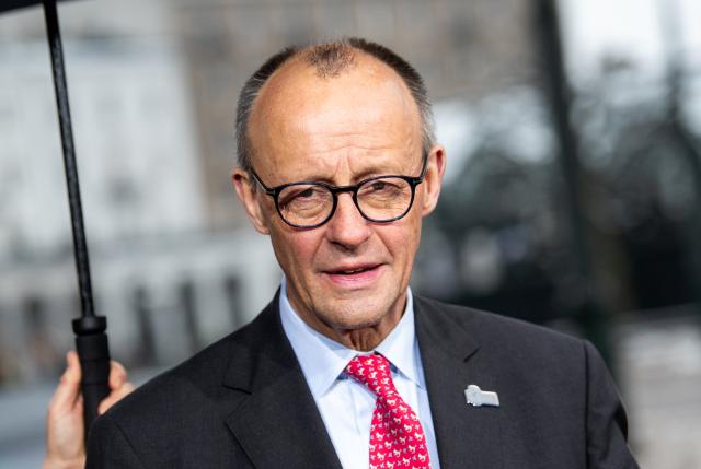 26 January 2026, Hamburg: German Chancellor Friedrich Merz, makes a statement at the summit of the North Sea states in front of Hamburg City Hall. Photo: Daniel Bockwoldt/dpa