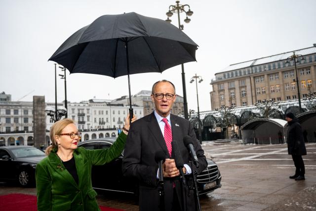 26 January 2026, Hamburg: German Chancellor Friedrich Merz, makes a statement at the summit of the North Sea states in front of Hamburg City Hall. Photo: Daniel Bockwoldt/dpa