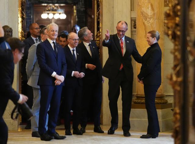 26 January 2026, Hamburg: German Chancellor Friedrich Merz (2nd R) joins Mette Frederiksen (R), Prime Minister of Denmark, Dick Schoof (3rd R), Prime Minister of the Netherlands, Luc Frieden (2nd L), Prime Minister of Luxembourg, and Jonas Gahr Store (L), Prime Minister of Norway, for the working session of the heads of state and government on security in the High North at the summit of the North Sea states in Hamburg. Photo: Marcus Brandt/dpa