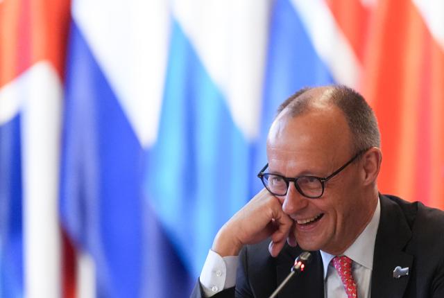 26 January 2026, Hamburg: German Chancellor Friedrich Merz smiles at the start of the working session of the heads of state and government on the topic of security in the High North, at the summit of the North Sea states in Hamburg. Photo: Marcus Brandt/dpa