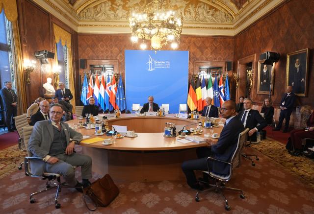 26 January 2026, Hamburg: Germany's Chancellor Friedrich Merz (C) sits with Denmark's Prime Minister Mette Frederiksen (L), the Netherlands' Prime Minister Dick Schoof (R), Belgium's Prime Minister Bart De Wever, Luxembourg's Prime Minister Luc Frieden, Norway's Prime Minister Jonas Gahr Store (2nd R), and Jean-Charles Ellermann-Kingombe (R), the North Atlantic Treaty Organization (NATO) Assistant Secretary General for Cyber and Digital Transformation, attend a working session of the heads of state and government on security in the High North at the summit of the North Sea states in Hamburg. Photo: Marcus Brandt/dpa