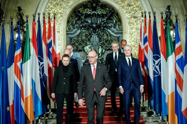 26 January 2026, Hamburg: Bart de Wever, Prime Minister of Belgium, Luc Frieden, Prime Minister of Luxembourg, Mette Frederiksen, Prime Minister of Denmark, German Chancellor Friedrich Merz, Jonas Gahr Store, Prime Minister of Norway, Dick Schoof, Prime Minister of the Netherlands, and Jean-Charles Ellermann-Kingombe, Deputy Secretary General of NATO for Cyber and Digital Transformation, stand together for the family photo at the summit of the North Sea states in Hamburg. Photo: Kay Nietfeld/dpa