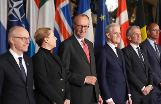 25 January 2026, Hamburg: (L-R) Luc Frieden, Prime Minister of Luxembourg, Mette Frederiksen, Prime Minister of Denmark, German Chancellor Friedrich Merz, Jonas Gahr Store, Prime Minister of Norway, Dick Schoof, Prime Minister of the Netherlands, and Jean-Charles Ellermann-Kingombe, Deputy Secretary General of NATO for Cyber and Digital Transformation, stand together for the family photo at the summit of the North Sea states in Hamburg. Photo: Marcus Brandt/dpa