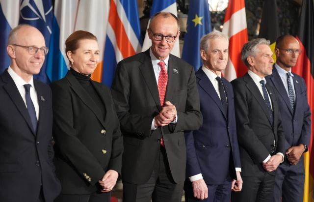25 January 2026, Hamburg: (L-R) Luc Frieden, Prime Minister of Luxembourg, Mette Frederiksen, Prime Minister of Denmark, German Chancellor Friedrich Merz, Jonas Gahr Store, Prime Minister of Norway, Dick Schoof, Prime Minister of the Netherlands, and Jean-Charles Ellermann-Kingombe, Deputy Secretary General of NATO for Cyber and Digital Transformation, stand together for the family photo at the summit of the North Sea states in Hamburg. Photo: Marcus Brandt/dpa