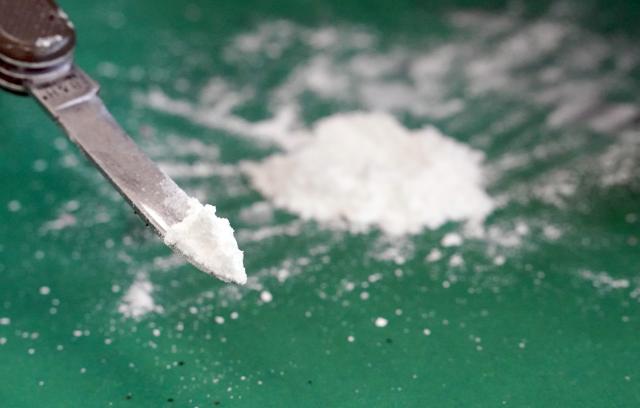 FILED - 24 February 2022, Hamburg: Cocaine is seen on the tip of a pocket knife. Photo: Marcus Brandt/dpa