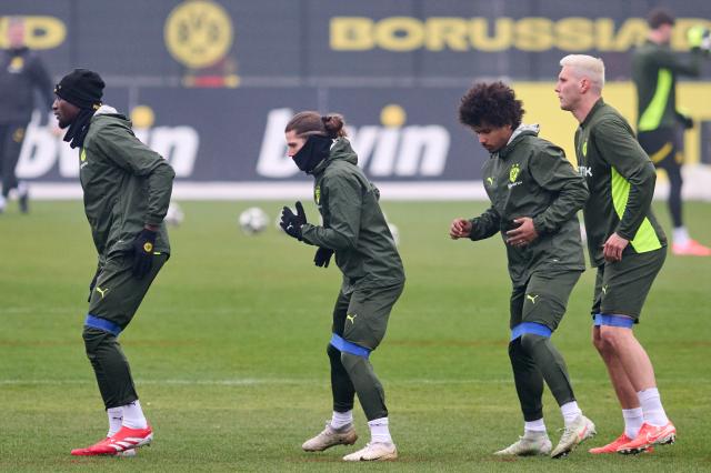 FILED - 11 March 2025, North Rhine-Westphalia, Dortmund: (L-R) Dortmund's Serhou Guirassy, Marcel Sabitzer, Karim Adeyemi and Niklas Suele participate in the team's final training session ahead of Wednesday's UEFA Champions League soccer match against LOSC Lille at Stade Pierre Mauroy. Borussia Dortmund trained without Niklas Sueüle and Marcel Sabitzer on Tuesday for their crucial final league phase match in the Champions League against Inter Milan. Photo: Bernd Thissen/dpa