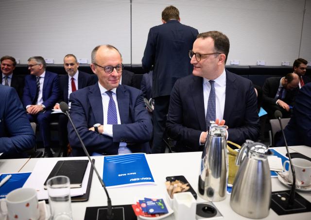 27 January 2026, Berlin: German Chancellor Friedrich Merz speaks to and Jens Spahn, Chairman of the CDU/CSU parliamentary group during the meeting of the Christian Democratic Union (CDU)/Christian Social Union (CSU) parliamentary group the German Parliament (Bundestag). Photo: Bernd von Jutrczenka/dpa