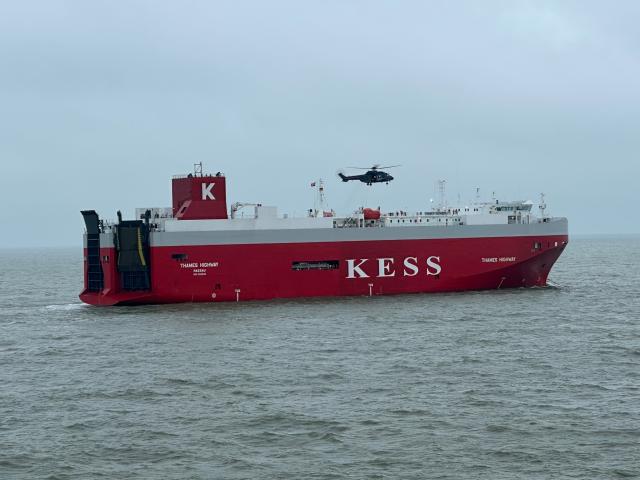 HANDOUT - 27 January 2026, Lower Saxony, ---: The MNV helicopter of the German Police flies over the car carrier MS "Thames Highway." Shortly after leaving the port of Emden on Monday evening, a fire broke out in the engine room. The vehicle carrier MS Thames Highway is to be towed back to the northern German port of Emden, the salvage company said on Tuesday. Photo: --/Havariekommando/dpa - ATTENTION: editorial use only in connection with the latest coverage and only if the credit mentioned above is referenced in full