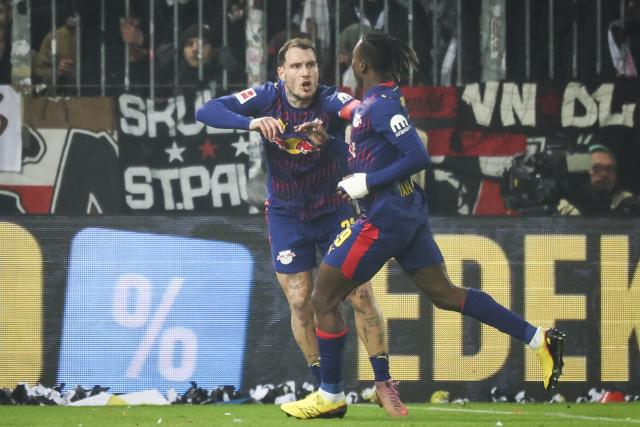 27 January 2026, Hamburg: Leipzig's Yan Diomande celebrates scoring his side's first goal during the German Bundesliga soccer match between FC St. Pauli and RB Leipzig at the Millerntor-Stadion. Photo: Christian Charisius/dpa - IMPORTANT NOTICE: DFL and DFB regulations prohibit any use of photographs as image sequences and/or quasi-video.