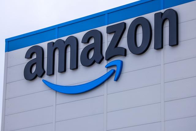 FILED - 19 September 2024, Mecklenburg-Western Pomerania, Dummerstorf: Amazon logo is seen on the online retailer's logistics center in Dummerstof. Photo: Jens Büttner/dpa