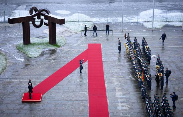 28 January 2026, Berlin: German Chancellor Friedrich Merz welcomes Ilie Bolojan, Prime Minister of Romania, with military honors in front of the Federal Chancellery in Berlin. Photo: Bernd von Jutrczenka/dpa