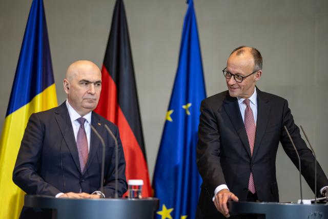 28 January 2026, Berlin: German Chancellor Friedrich Merz (R) and Romanian Prime Minister Ilie Bolojan speak during a press conference after their meeting at the Federal Chancellery. Photo: Fabian Sommer/dpa