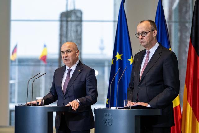 28 January 2026, Berlin: German Chancellor Friedrich Merz (R) and Romanian Prime Minister Ilie Bolojan speak during a press conference after their meeting at the Federal Chancellery. Photo: Fabian Sommer/dpa