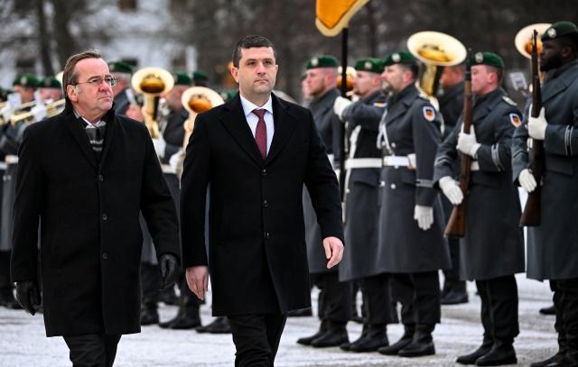 28 January 2026, Berlin: German Minister of Defense Boris Pistorius (L) welcomes his Romanian counterpart Radu-Dinel Miruta ahead of their meeting. Photo: Britta Pedersen/dpa