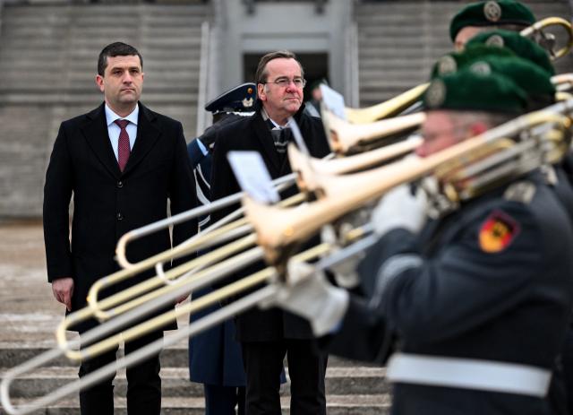 28 January 2026, Berlin: German Minister of Defense Boris Pistorius (R) welcomes his Romanian counterpart Radu-Dinel Miruta ahead of their meeting. Photo: Britta Pedersen/dpa