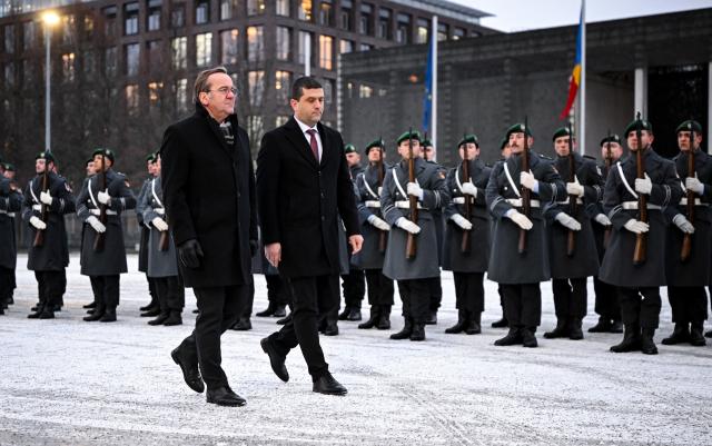 28 January 2026, Berlin: German Minister of Defense Boris Pistorius (L) welcomes his Romanian counterpart Radu-Dinel Miruta ahead of their meeting. Photo: Britta Pedersen/dpa
