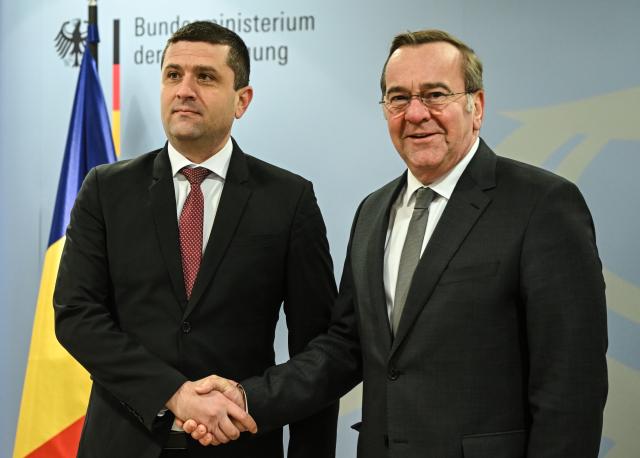 28 January 2026, Berlin: German Minister of Defense Boris Pistorius (R) welcomes his Romanian counterpart Radu-Dinel Miruta ahead of their meeting. Photo: Britta Pedersen/dpa