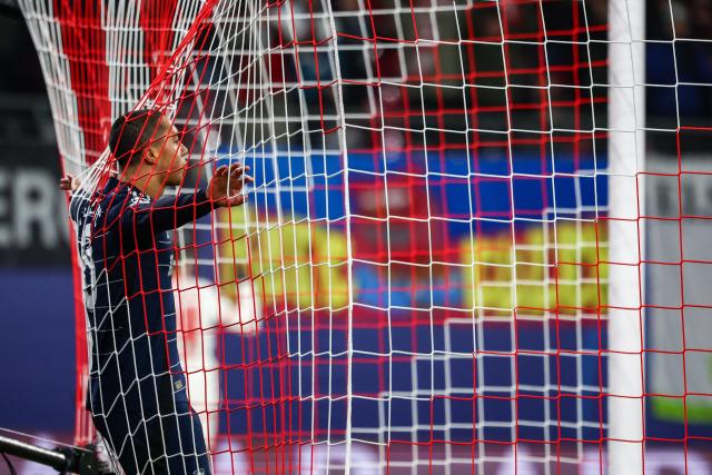 FILED - 10 December 2024, Saxony, Leipzig: Aston Villa's Youri Tielemans leans on the goal net after a goal during the UEFA Champions League soccer match between RB Leipzig and Aston Villa at Red Bull Arena. Photo: Jan Woitas/dpa