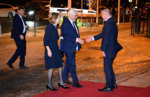 28 January 2026, Berlin: Governing Mayor of Berlin Kai Wegner (R) welcomes German President Frank-Walter Steinmeier and his wife Elke Buedenbender in front of the Red City Hall, ahead of a dinner in honor of Federal President Steinmeier as an honorary citizen of Berlin on the occasion of his 70th birthday. Photo: Bernd von Jutrczenka/dpa