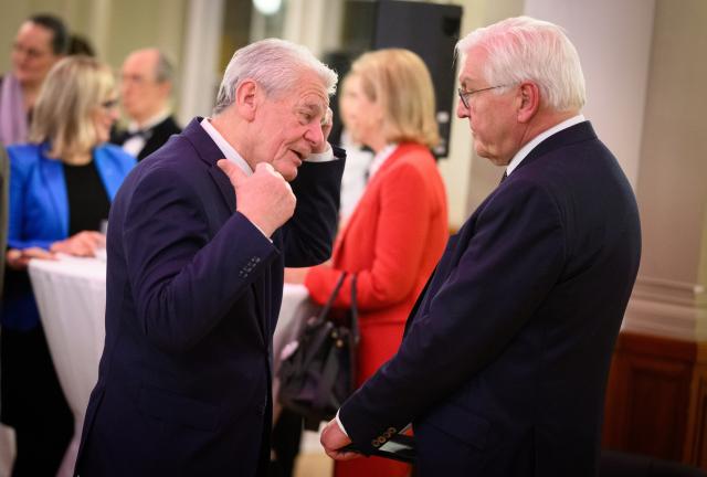 28 January 2026, Berlin: Former Federal President Joachim Gauck (L)talks with German President Frank-Walter Steinmeier  during a dinner in honor of Federal President Steinmeier as an honorary citizen of Berlin on the occasion of his 70th birthday. Photo: Bernd von Jutrczenka/dpa