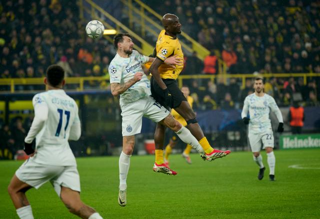 28 January 2026, North Rhine-Westphalia, Dortmund: Borussia Dortmund Serhou Guirassy (R) and Inter Milan's Francesco Acerbi battle for the ball during the UEFA Champions League soccer match between Borussia Dortmund and Inter Milan at Signal Iduna Park. Photo: Bernd Thissen/dpa