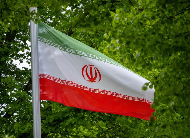 FILED - 19 May 2023, Berlin: The flag of the Islamic Republic of Iran flies in the wind in front of the Iranian embassy in Berlin. Photo: Monika Skolimowska/dpa