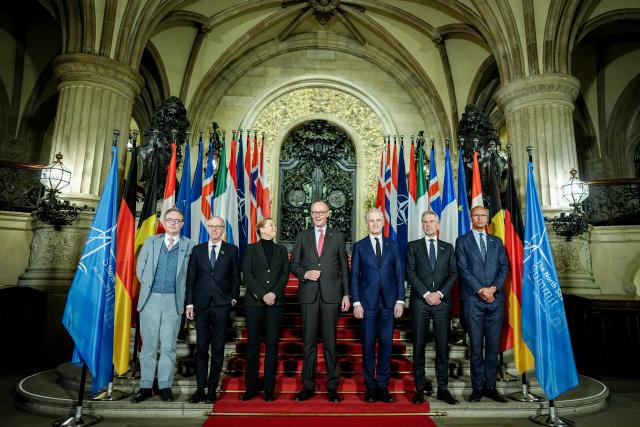 FILED - 26 January 2026, Hamburg: Bart de Wever, Prime Minister of Belgium, Luc Frieden, Prime Minister of Luxembourg, Mette Frederiksen, Prime Minister of Denmark, German Chancellor Friedrich Merz, Jonas Gahr Store, Prime Minister of Norway, Dick Schoof, Prime Minister of the Netherlands, and Jean-Charles Ellermann-Kingombe, Deputy Secretary General of NATO for Cyber and Digital Transformation, stand together for the family photo at the summit of the North Sea states in Hamburg. Photo: Kay Nietfeld/dpa