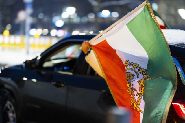 30 January 2026, Lower Saxony, Hanover: Participants with Iran's Pre-Islamic revolution flags attached to their vehicles, drive in a motorcade the city center of Hanover, to protests against violence by the Iranian government. Photo: Michael Matthey/dpa - ATTENTION: individual(s) has/have been pixelated for legal reasons