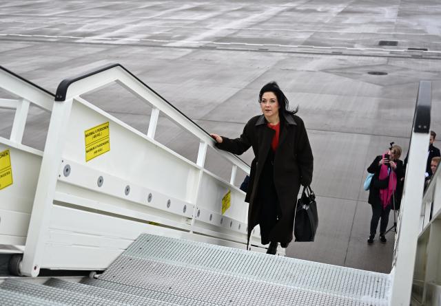 31 January 2026, Brandenburg, Schoenefeld: Katherina Reiche, German Minister for Economic Affairs and Energy, gets on an airplane of the German Air Force. Photo: Elisa Schu/dpa