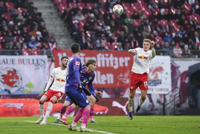 31 January 2026, Saxony, Leipzig: Leipzig's Conrad Harder scores his side's first goal during the German Bundesliga soccer match between RB Leipzig and FSV Mainz 05 at the Red Bull Arena. Photo: Jan Woitas/dpa - IMPORTANT NOTICE: DFL and DFB regulations prohibit any use of photographs as image sequences and/or quasi-video.