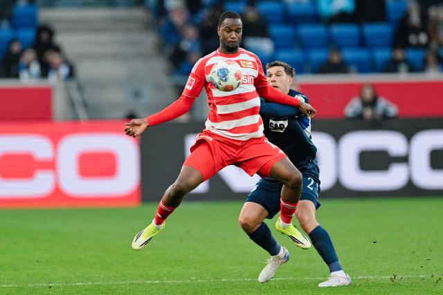 31 January 2026, Baden-Württemberg, Sinsheim: Union Berlin's Ilyas Ansah and Hoffenheim's Robin Hranac battle for the ball during the German Bundesliga soccer match between TSG 1899 Hoffenheim and 1. FC Union Berlin at the PreZero Arena. Photo: Uwe Anspach/dpa - IMPORTANT NOTICE: DFL and DFB regulations prohibit any use of photographs as image sequences and/or quasi-video.