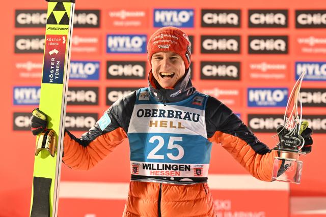 30 January 2026, Hesse, Willingen: Germany's second-placed Karl Geiger celebrates on the podium after the men's Large Hill competition of the FIS Ski Jumping World Cup FIS Ski Jumping World Cup in Willingen. Photo: Swen Pförtner/dpa