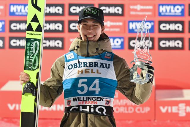 30 January 2026, Hesse, Willingen: Japan's third-placed Ren Nikaido celebrates on the podium after the the men's Large Hill competition of the FIS Ski Jumping World Cup FIS Ski Jumping World Cup in Willingen. Photo: Swen Pförtner/dpa